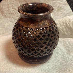 Candle holder. Cover is lattice drilled sandstone.